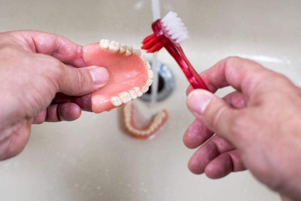 Remove Denture Adhesive